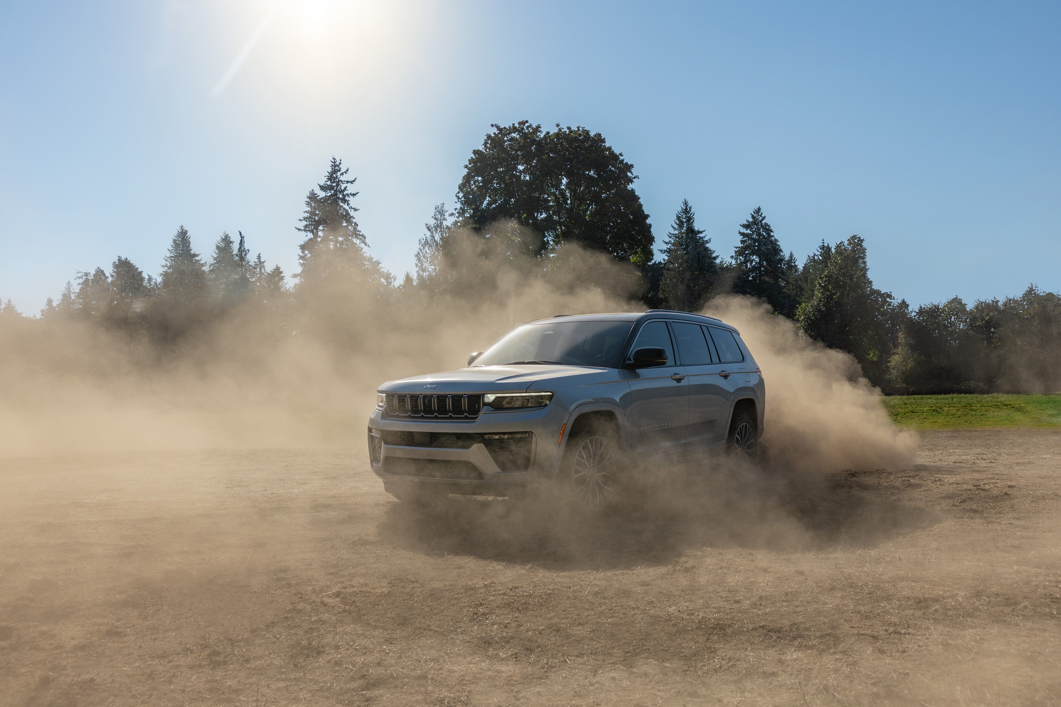 2026 Jeep Grand Cherokee driving off-road demonstrating powertrain and performance capability